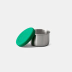 Front view of Little Dipper container with lid off, inside is empty.
