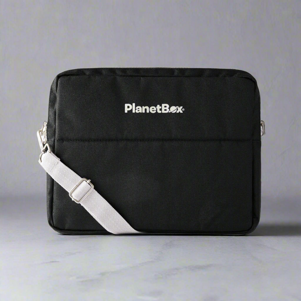 color::Black Currant | Black lunchbox carrying bag with white strap.