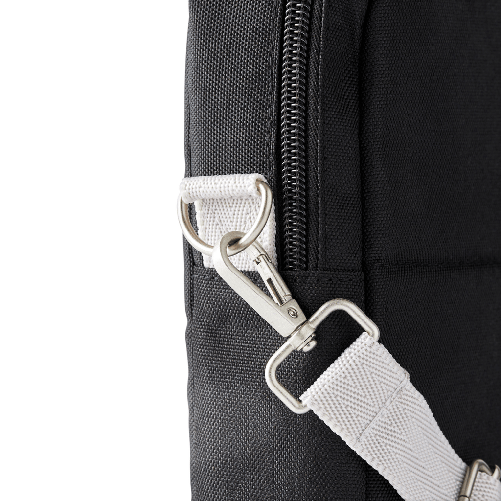 Closeup view of metal hardware on adjustable strap latch point showing removable clip.